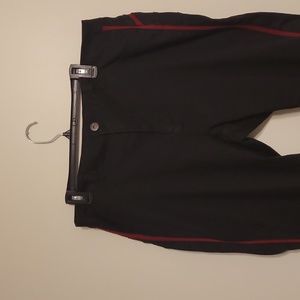 NWT Ashley Stewart black jeans with red stripe down sides.